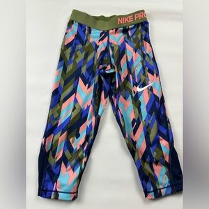 Nike dry fit crop leggings. Geometric pattern. Stretchy logo waist Size M girls